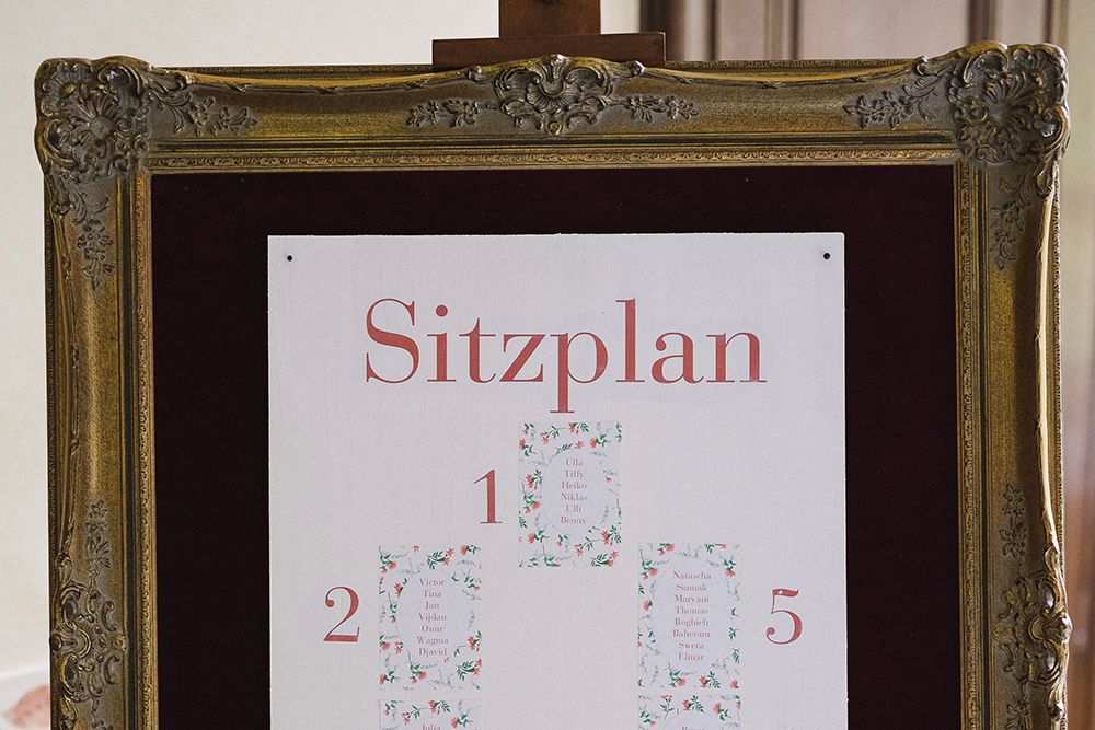 Framed seating plan labeled “Seating Plan” with numbered sections.